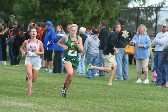 Grace holds off one last surge from a competing runner, beating her at the line